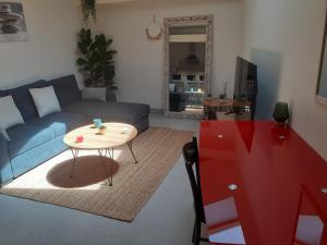 Et opholdsområde på Appartement climatisé + 22 billeder