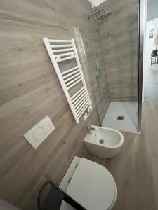 a bathroom with a shower and a toilet and a sink at House of Flowers in Spinea +12 photos