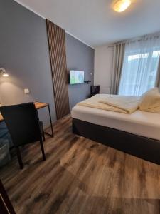 Postel nebo postele na pokoji v ubytování Hotel Kurhaus Uhlenberg