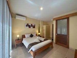 Imagen de la galería de Oka's Guest House Canggu, en Canggu