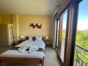 Imagen de la galería de Oka's Guest House Canggu, en Canggu 41 fotos más