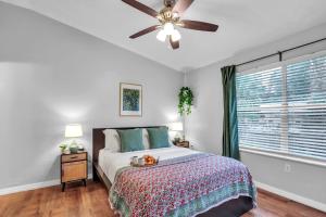 a bedroom with a bed and a ceiling fan at The Prairie at Brighton - UF , Pool , Workspace in Gainesville