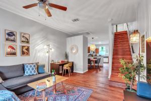 a living room with a couch and a table at The Prairie at Brighton - UF , Pool , Workspace in Gainesville +21 photos