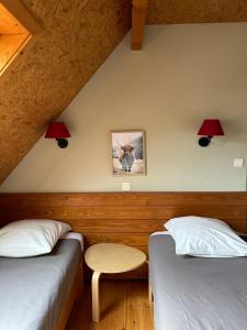 Cama o camas de una habitación en Les chalets d'Arrens