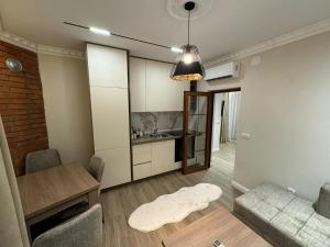 Η κουζίνα ή μικρή κουζίνα στο Apart Hotel Llolla
