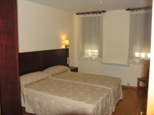 Postel nebo postele na pokoji v ubytování Villa Russell Hotel&Apartments