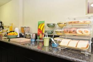 a kitchen with a counter with food on it at Comfort Inn San Diego Miramar in Miramar