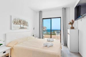 Ένα ή περισσότερα κρεβάτια σε δωμάτιο στο Atlantic Penthouse Retreat +19 φωτογραφίες