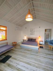 Voodi või voodid majutusasutuse Sleeping Elephant Beach Resort toas