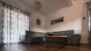 a living room with a couch and a table at Sea Level in Kotor