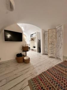 a living room with a flat screen tv on the wall at Avenoir 1bedroom Luxury Cave Villa in Vóthon