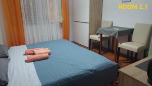 Postel nebo postele na pokoji v ubytování Guest House Lovric