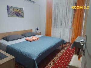 Postel nebo postele na pokoji v ubytování Guest House Lovric