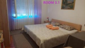 Postel nebo postele na pokoji v ubytování Guest House Lovric
