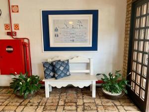 Uma área de estar em Hotel Pousada Solar do Parcel