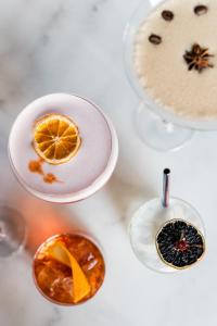 a table topped with different types of drinks at Hotel A'mare in Zadar
