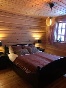 Postel nebo postele na pokoji v ubytování Hyggelig laftehytte på 140kvm med Ski-In/Out