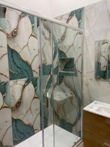 a bathroom with a shower and a sink at Maison Museo in Naples