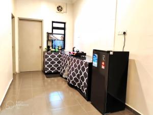 a room with a black and white table with a mirror at AA Homestay Bandar Mahkota Banting in Banting