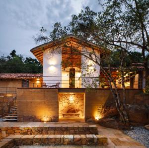 a house with a fireplace in front of it at Terrazul Barichara in Barichara