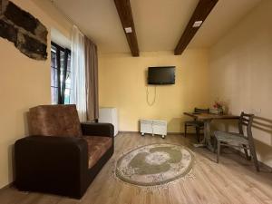 a living room with a couch and a table at Home-restaurant in Vanadzor in Vanadzor