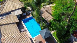 A piscina localizada em Hotel Pousada Coqueiros ou nos arredores
