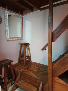 a room with two bunk beds and a mirror at Casita azul Bariloche in San Carlos de Bariloche