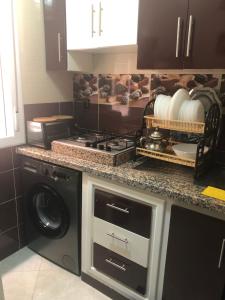 Köök või kööginurk majutusasutuses Appartement confortable neuf
