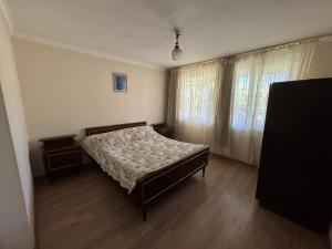 a bedroom with a bed and a window at Zindisi Forest Haven Retreat in Surami in Surami +16 photos
