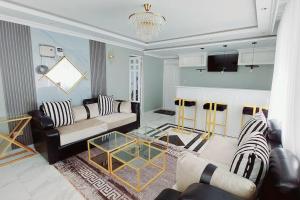 TV a/nebo společenská místnost v ubytování JK Residence Kikuyu