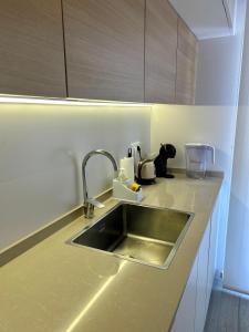 a kitchen with a sink and a counter top at Sunny Stay in Torre De La Horadada in Torre de la Horadada