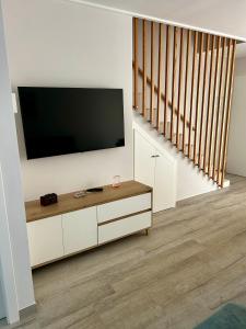 a living room with a flat screen tv on a wall at Sunny Stay in Torre De La Horadada in Torre de la Horadada