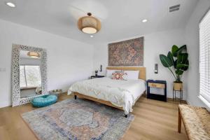 a bedroom with a bed and a mirror and a rug at Casa Malca Tulum in Indio +83 photos