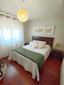 Ένα ή περισσότερα κρεβάτια σε δωμάτιο στο Apartamento San Mauro +13 φωτογραφίες