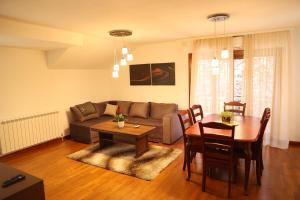 a living room with a couch and a table at Ego apartmanii in Ćuprija