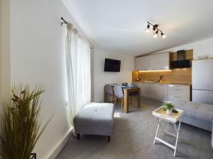 a living room with a couch and a table at Apartmani Jesenova in Selce