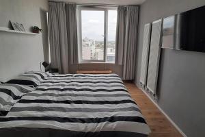 Postel nebo postele na pokoji v ubytování Paradijs in Zandvoort