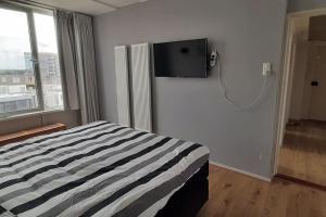 TV a/nebo společenská místnost v ubytování Paradijs in Zandvoort + 9 fotografií