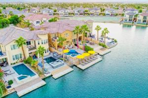 an aerial view of a house with a swimming pool at Lakeside Luxury in Indio