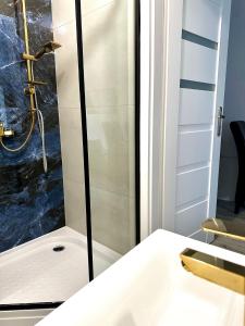 Kúpeľňa v ubytovaní Apartament Wygodny S2