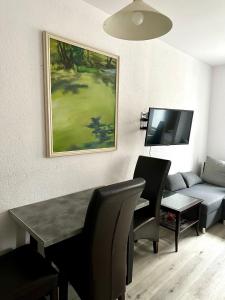 Televízia a/alebo spoločenská miestnosť v ubytovaní Apartament Wygodny S2