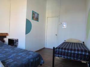 Postel nebo postele na pokoji v ubytování Valparadise Hostel