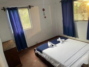 Postel nebo postele na pokoji v ubytování Casa y Restaurante- Pizzeria La Pergola