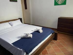 Postel nebo postele na pokoji v ubytování Casa y Restaurante- Pizzeria La Pergola