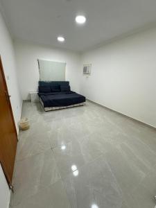 a room with a bed in the middle of it at نجوم السعد 9 in Al Masfalah