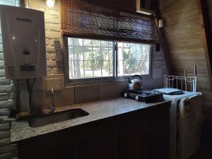 Køkken eller tekøkken på Cabañas Alpinas San Pedro