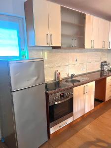 Η κουζίνα ή μικρή κουζίνα στο Guest House Milla