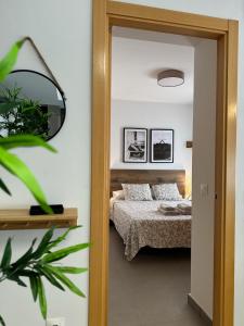 Posteľ alebo postele v izbe v ubytovaní Apartamentos Vernia 4-15