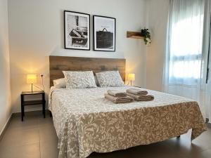 Posteľ alebo postele v izbe v ubytovaní Apartamentos Vernia 4-15