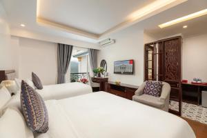 Postel nebo postele na pokoji v ubytování Sapa Praha Hotel + 37 fotografií